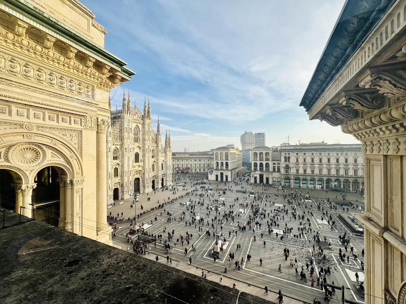Piazza del Duomo in Milan seen from above, with the cathedral spires