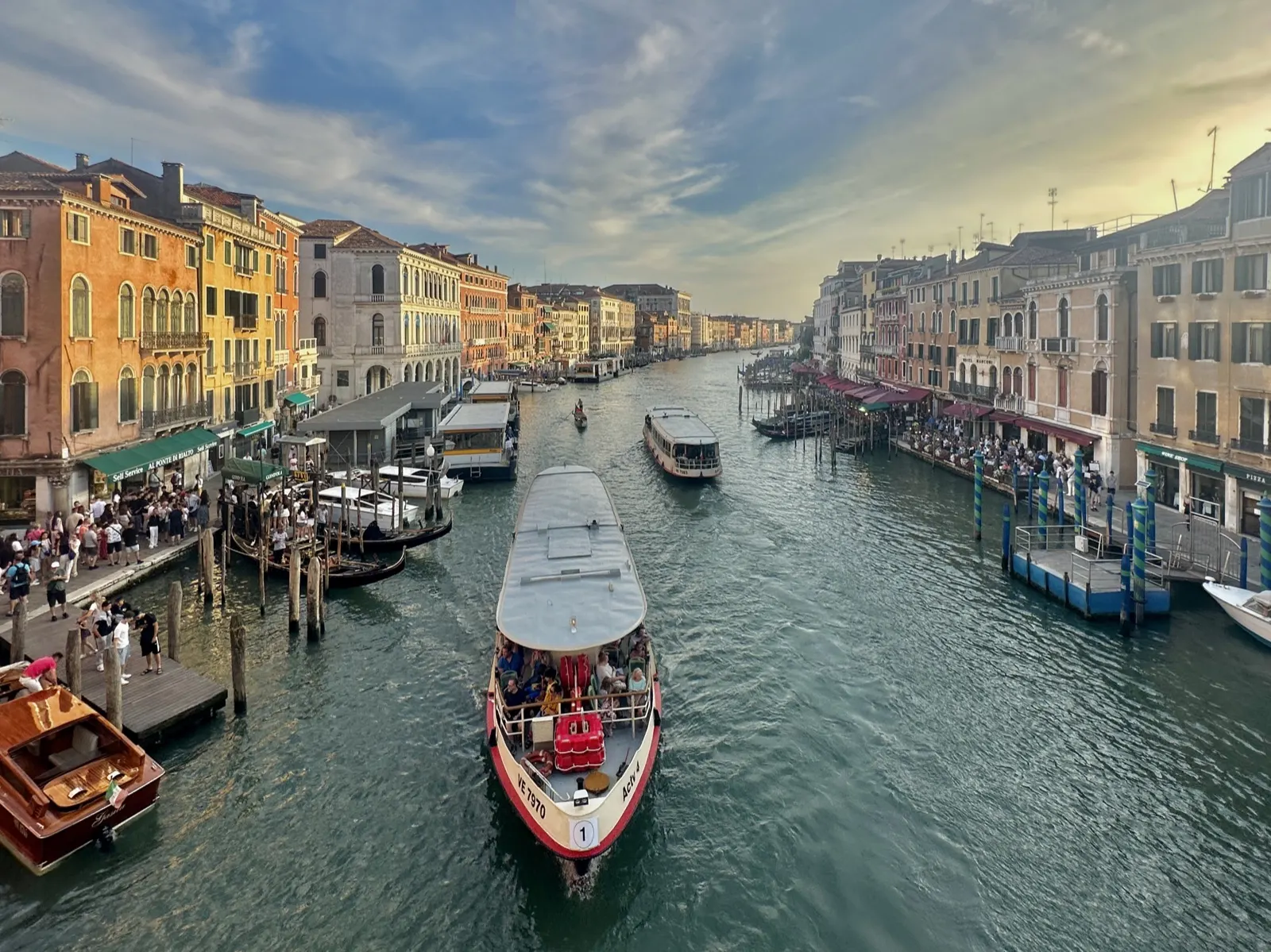 A vaporetto heading down Venice's Grand Canal at golden hour